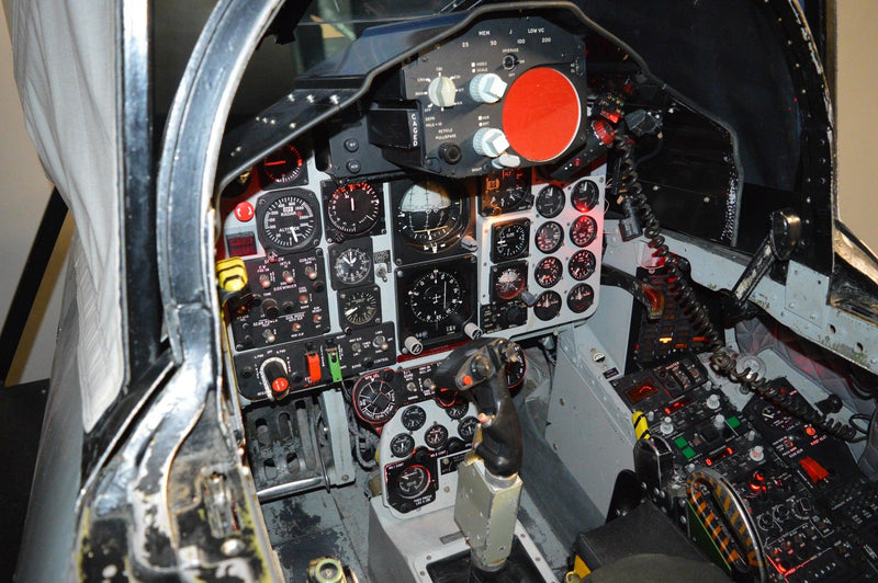 F-4 Phantom cockpit with flight simulator controls, instrument panels, and switches